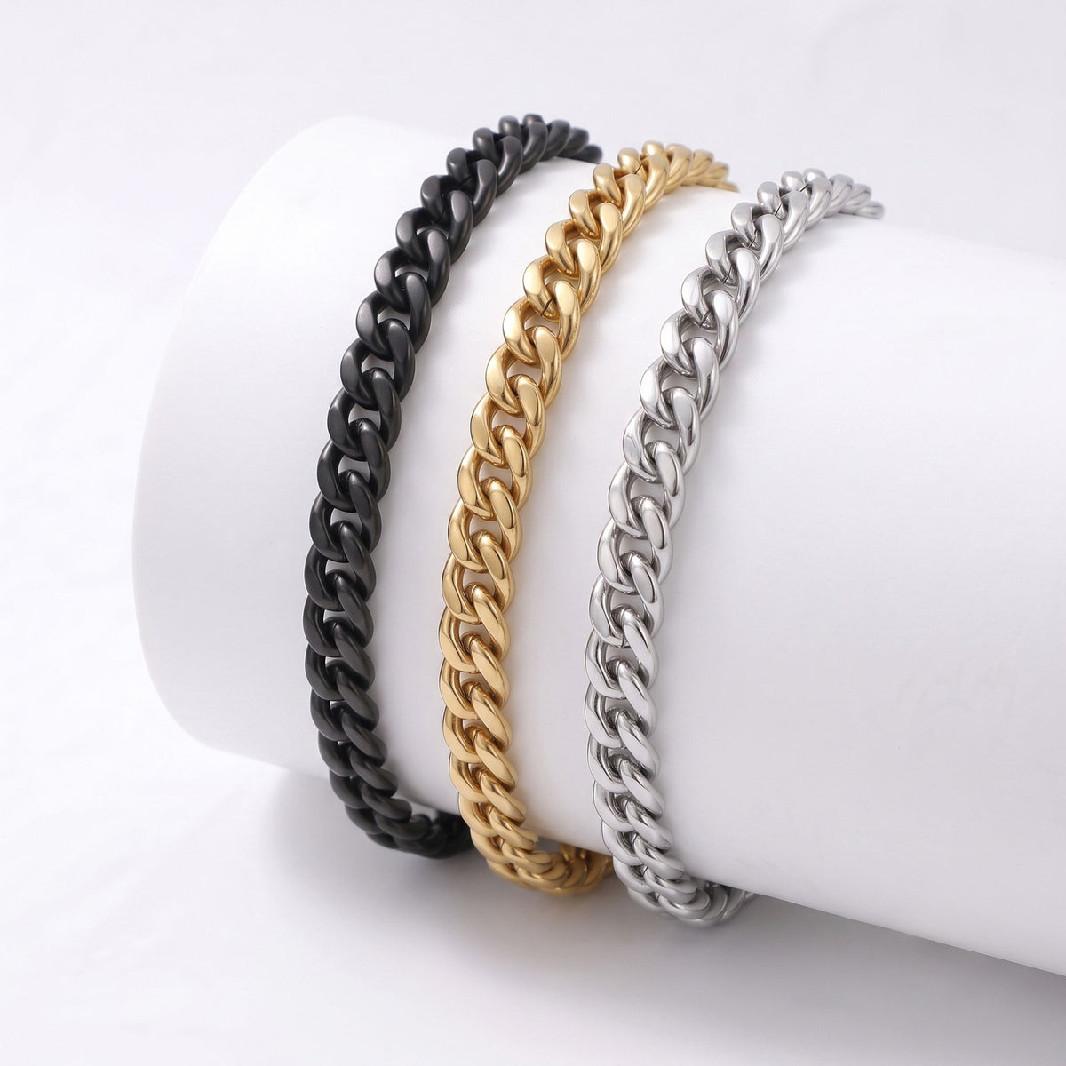 Silindire sarılmış üç flat mariner bileklik: gold, siyah ve gümüş